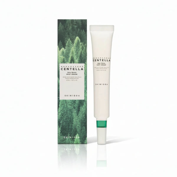 Crema facial coreana SKIN1004 Tea-Trica Spot en frasco de 20 ml, con fórmula para aliviar y tratar manchas en la piel.