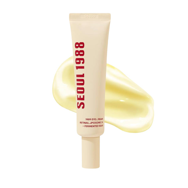 Crema para ojos K-SECRET SEOUL 1988 con retinal liposome 4% y fermentado de soja, en frasco con envase blanco y aplicador.