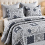 Cubrecama quilt bordado King de 5 piezas con diseño geométrico de Casa Eterna en colores suaves y detalles elegantes.