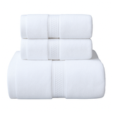 Conjunto de 3 toallas de baño y mano de algodón en colores neutros, ideales para uso hotelero y decoración de baño.
