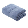Toalla de baño de cuerpo en algodón grueso de la marca Enigma Store, textura suave y absorbente, lista para su uso.