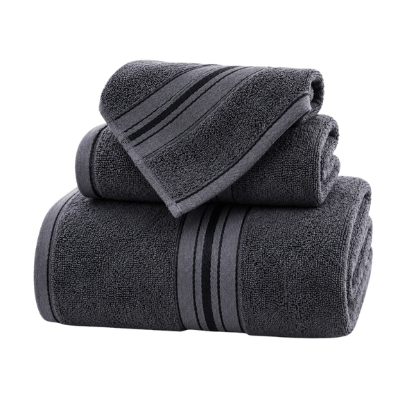 Pack de 3 toallas de cuerpo, mano y cara de algodón absorbente de la marca Enigma Store, en diferentes tamaños y colores.