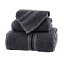 Pack de 3 toallas de cuerpo, mano y cara de algodón absorbente de la marca Enigma Store, en diferentes tamaños y colores.