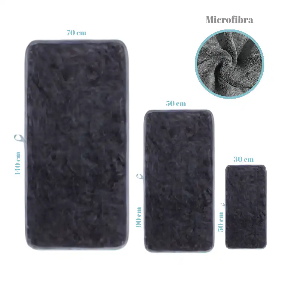 Set de 3 toallas negras de microfibra para cuerpo, manos y cara, de la marca Enigma Store, en imagen.