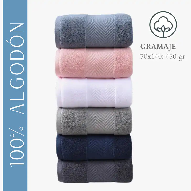 Tres toallas de baño en algodón de 70x140 cm y 450g, color blanco, en un set de hotel, de la marca Enigma Store.