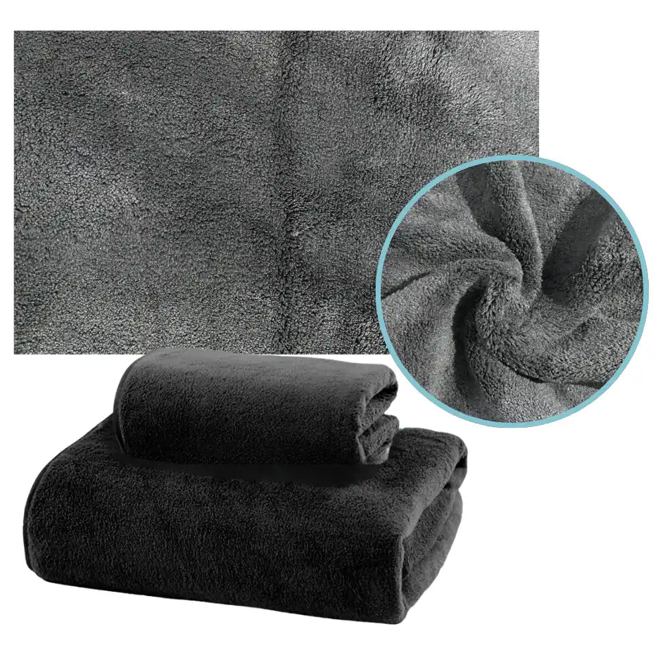 Pack de 3 toallas negras de microfibra para cuerpo, manos y cara, de la marca Enigma Store, en la imagen.