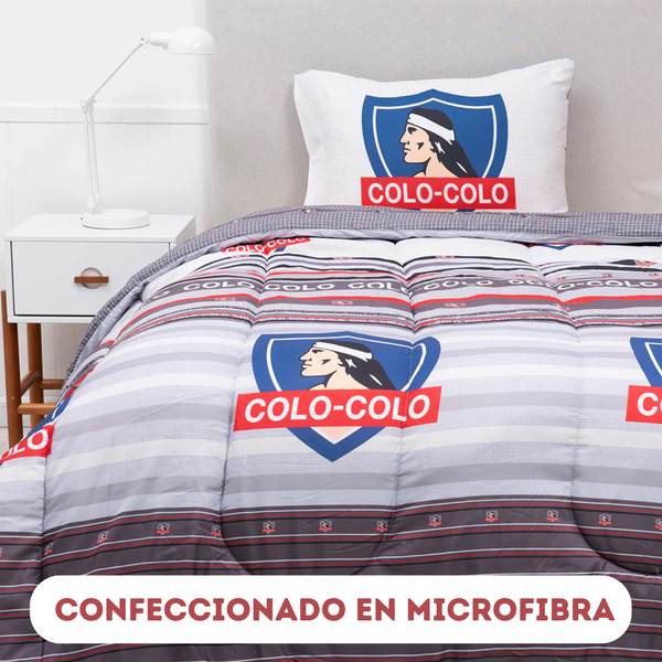 Plumón de 1.5 plazas Colo-Colo Vencedores, licencia Enigma Store, con diseño en colores blancos y rojos sobre fondo suave.