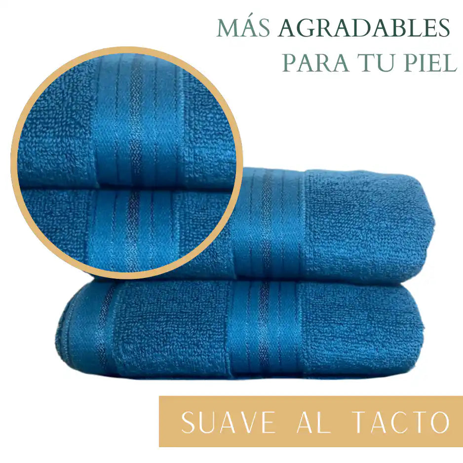 Set de 4 toallas de algodón azul profundo de 130 g, ideales para hotel y spa, con textura suave y absorbente.