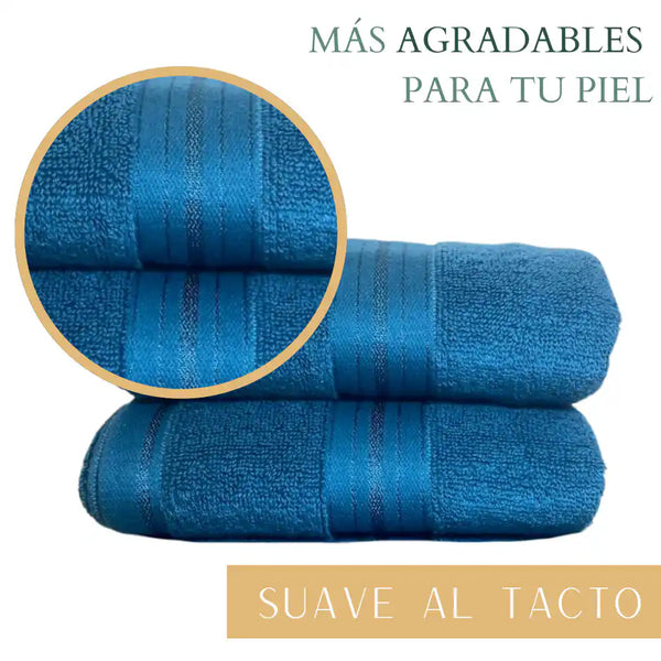 Set de 4 toallas de algodón azul profundo de 130 g, ideales para hotel y spa, con textura suave y absorbente.