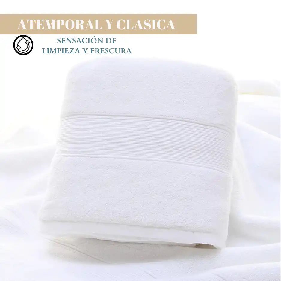 Juego de 4 toallas blancas de algodón de 130 g, ideales para spa y hotel, con textura suave y absorbente.