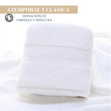Juego de 4 toallas blancas de algodón de 130 g, ideales para spa y hotel, con textura suave y absorbente.