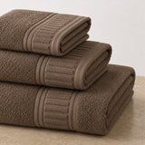 Set de toallas de baño premium de algodón 100% con 700 GSM, incluye 3 piezas, en colores suaves y absorbentes.